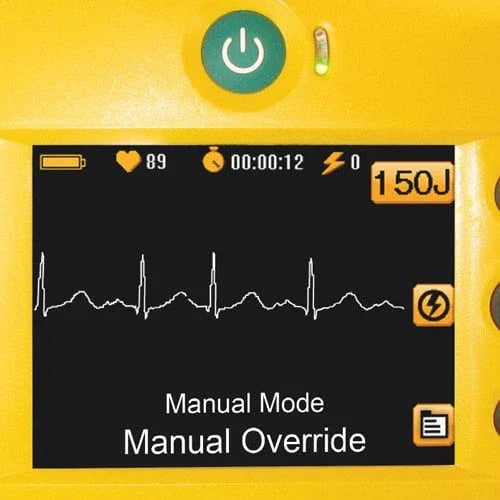Defibrillator screen showing ECG waveform, heart rate, and manual override settings