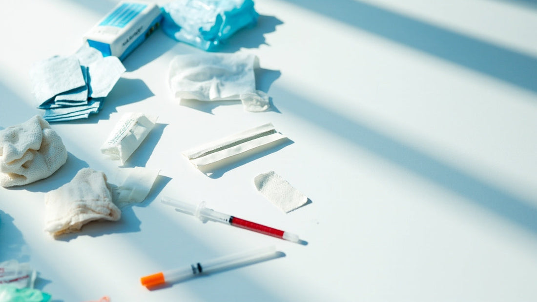 neatly arranged medical emergency supplies on white background with soft natural lighting
