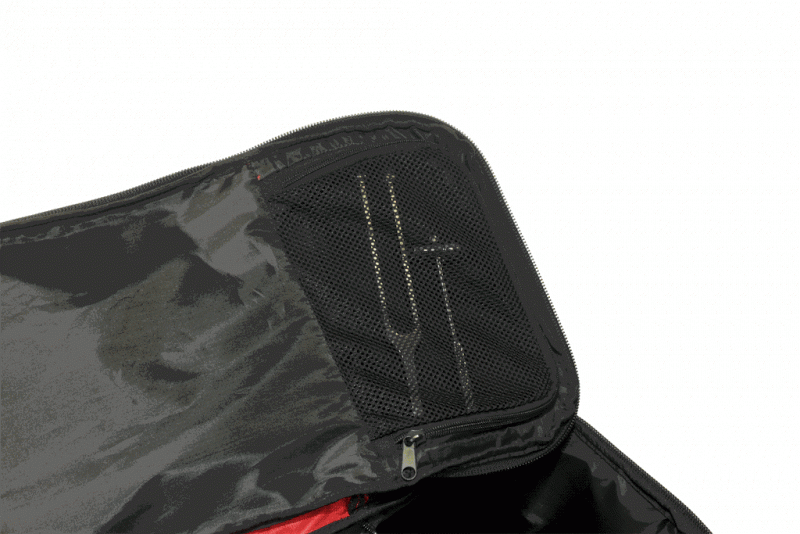 Black emergency medical bag with mesh zippered pocket holding tools