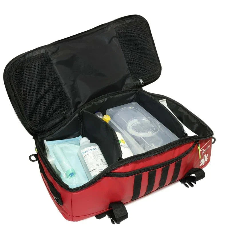 Open red emergency medical bag with organized compartments and first aid supplies
